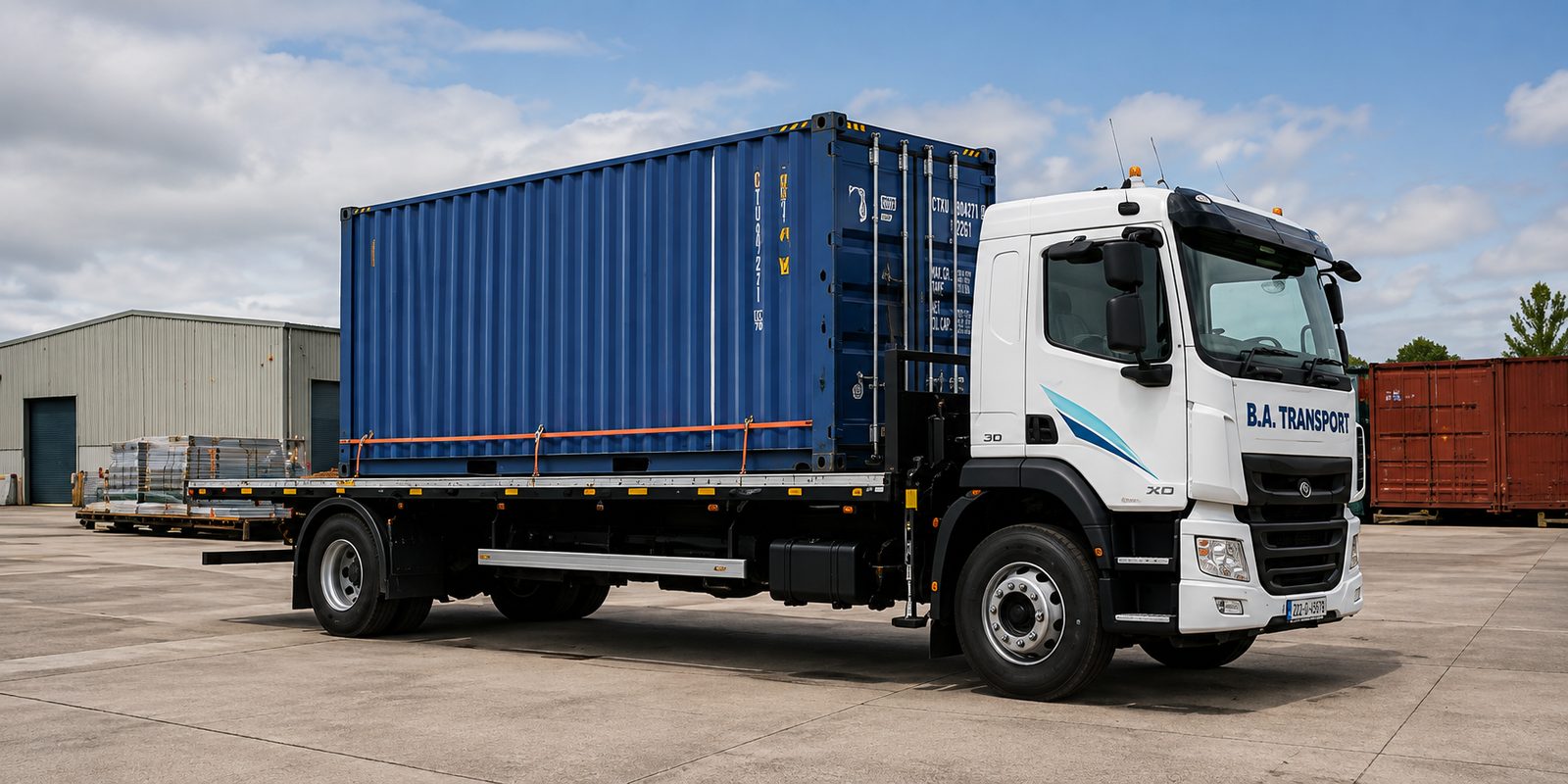 Container transport — shipping container carried on a BA Transport flatbed truck in Ireland